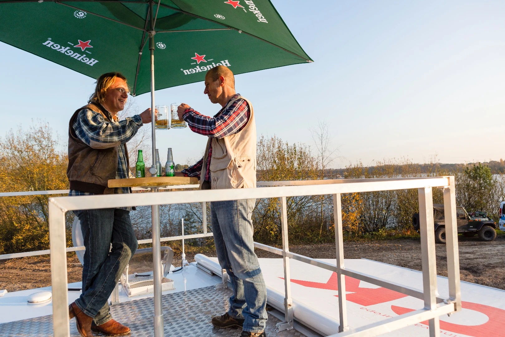 The bar/cafe table and umbrella make a functional rooftop lounge