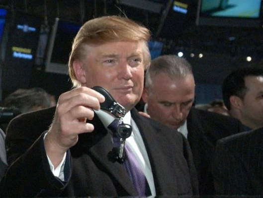 Billionaire real estate developer Donald Trump gets the keys to the first Cadillac DTS Executive Limousine