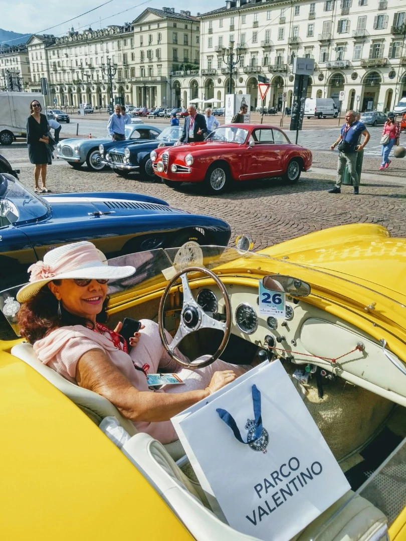 A 1958 AC Bristol Spider in Piazza Vittorio Veneto in Turin, photographed before the fashion show at the Castello del Valentino
