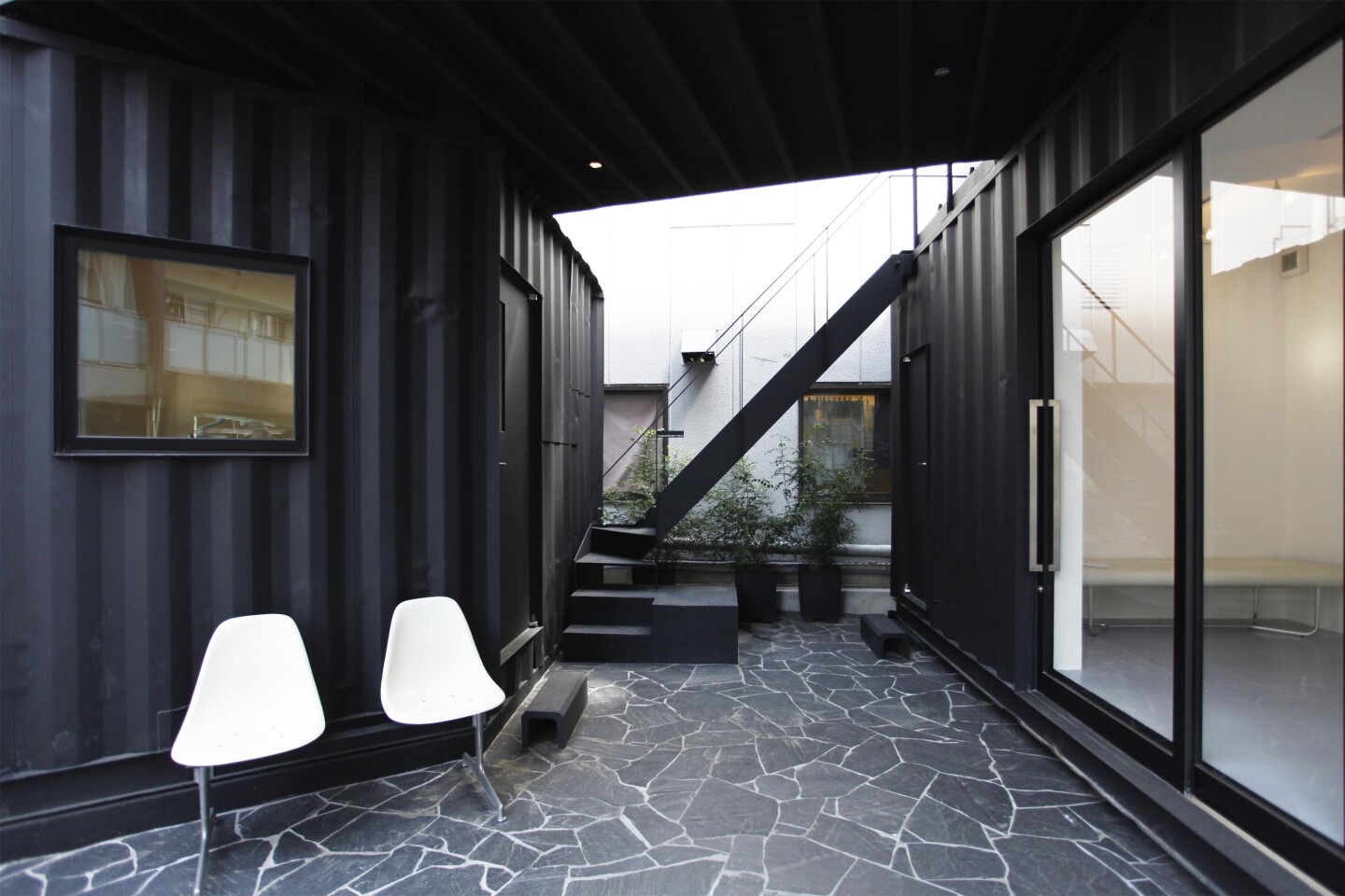 These two small rooms face in towards each other and are connected via a central exterior courtyard