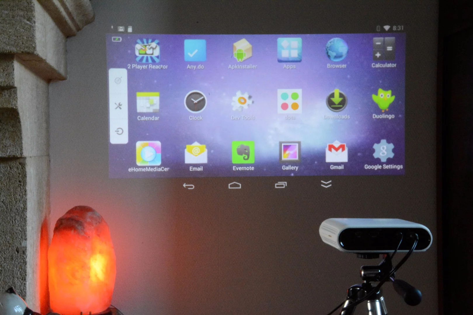 The Home screen has three rows of 18 icons, with a double down arrow at the bottom to scroll onto more