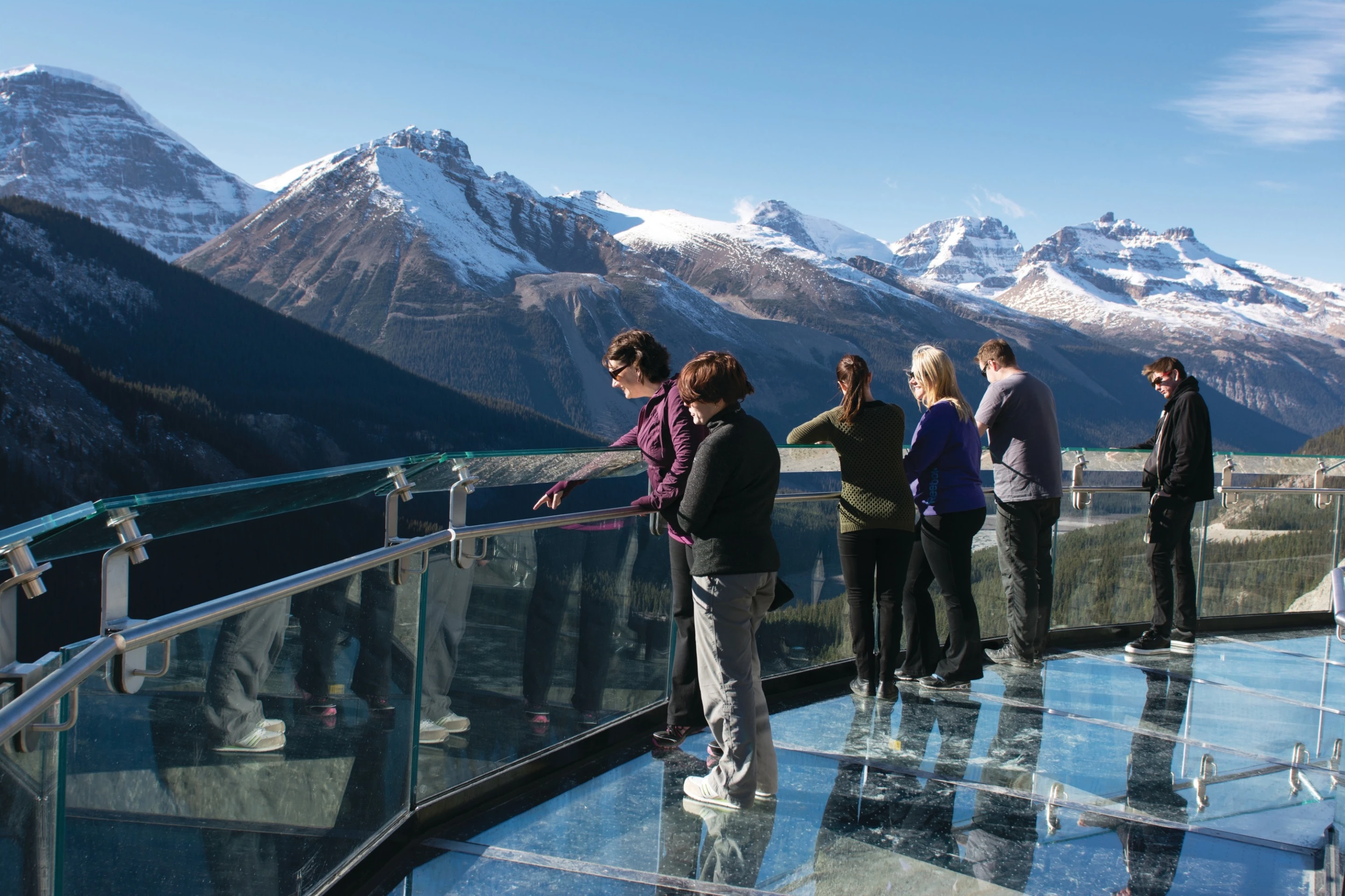 Visitors standing on the glass-floor platform of the Glacier Skywalk hovering 280 meters (918 ft) above Sunwapta Valley (Photo: Brewster Travel Canada)