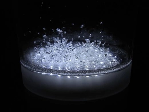 From the side, the liquid bounces to the beat of the music