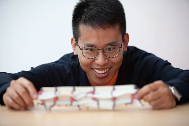 Lead author Xiuming Zhang with one of the team's motion sculptures