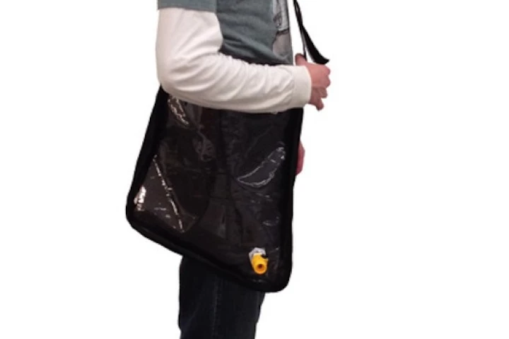 The Solar Bag can be carried like a satchel for easier transport and will begin to purify water as the user walks