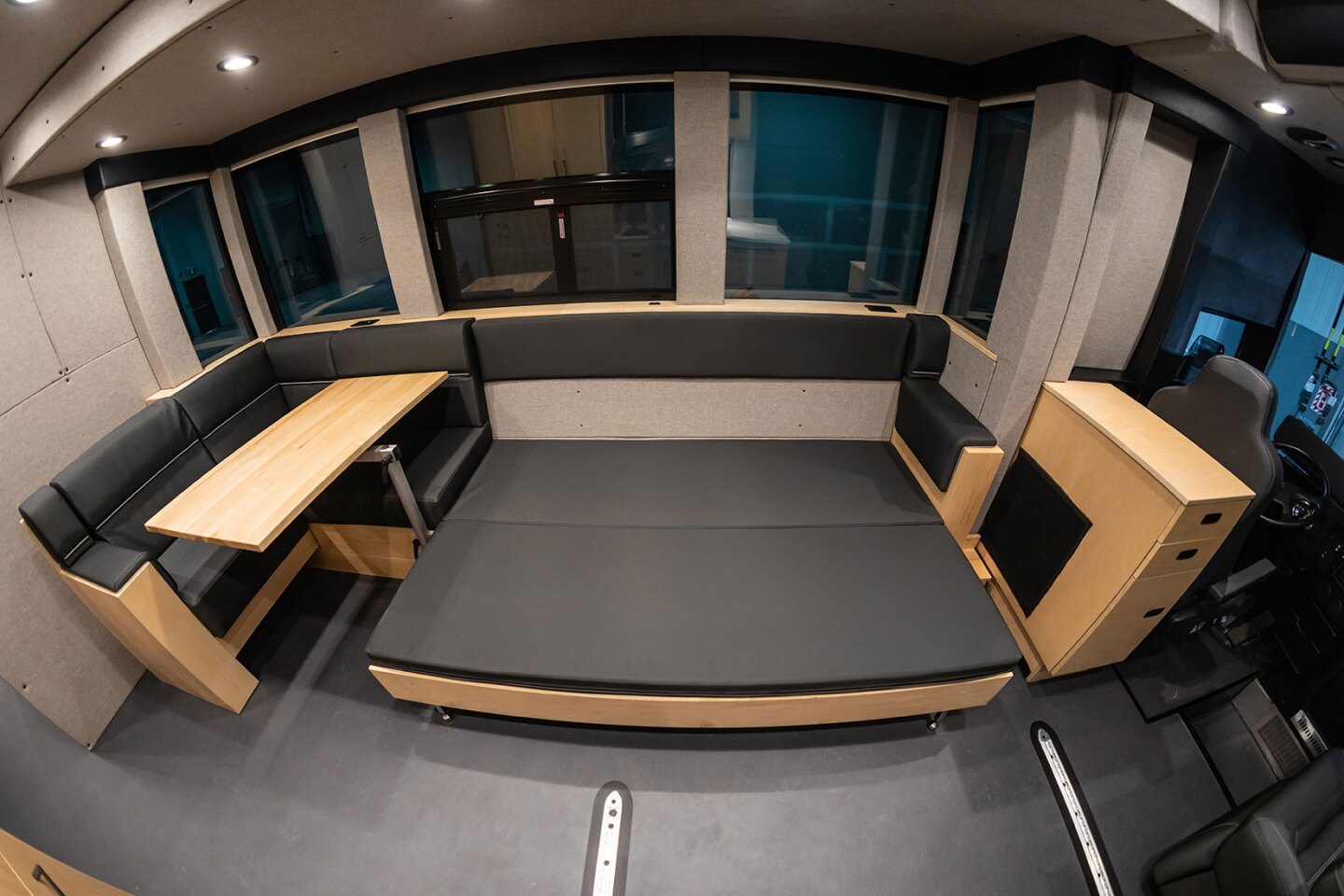 That large couch can split into a bed and corner dining nook