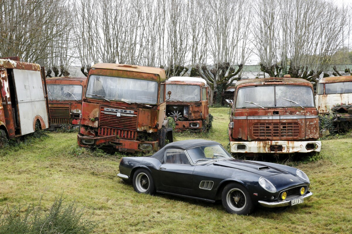 The Ferrari 250 GT California SWB Spider from the Baillon Collection sits among relics from Baillon's booming transport business of five decades ago © Artcurial