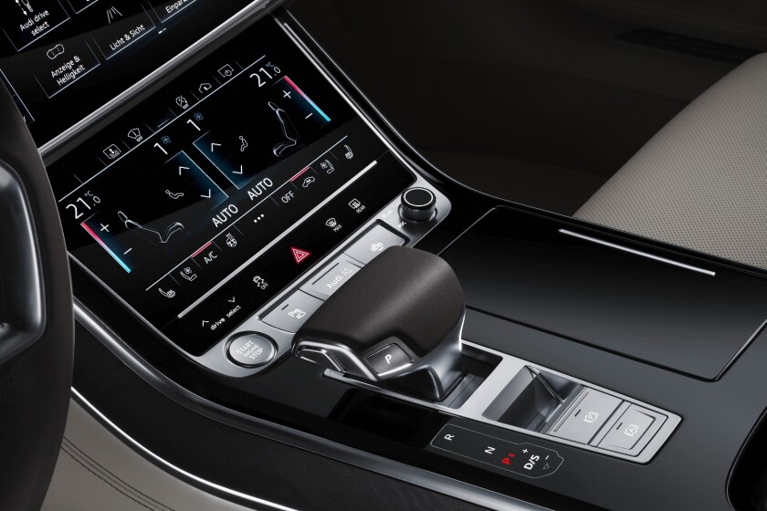 The dual touchscreen console control center handles climate control and other functions on its lower screen