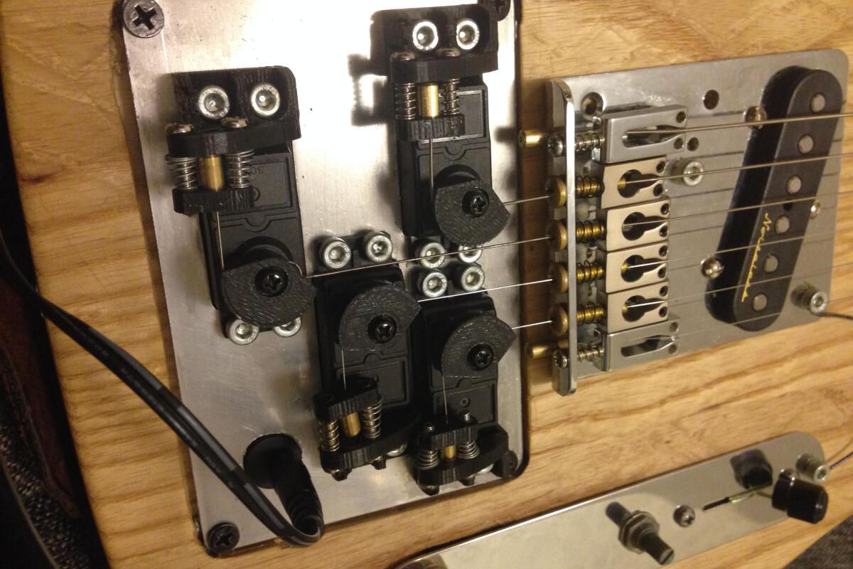 The servos are controlled by a cabled foot pedal via an Arduino running custom code