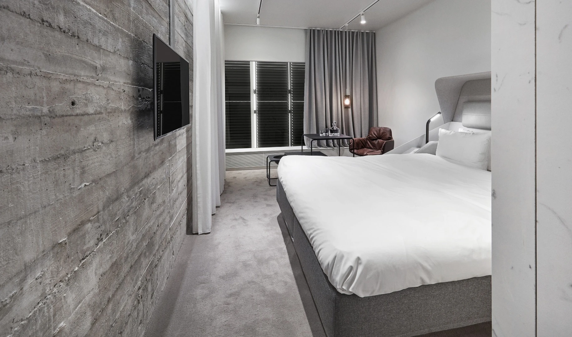 The industrial theme of the Hotel Herman K continues indoors with exposed concrete surfaces