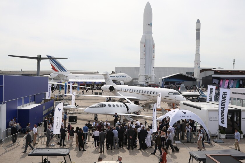 A crowd gathers around the Alice electric plane at the Paris Air Show