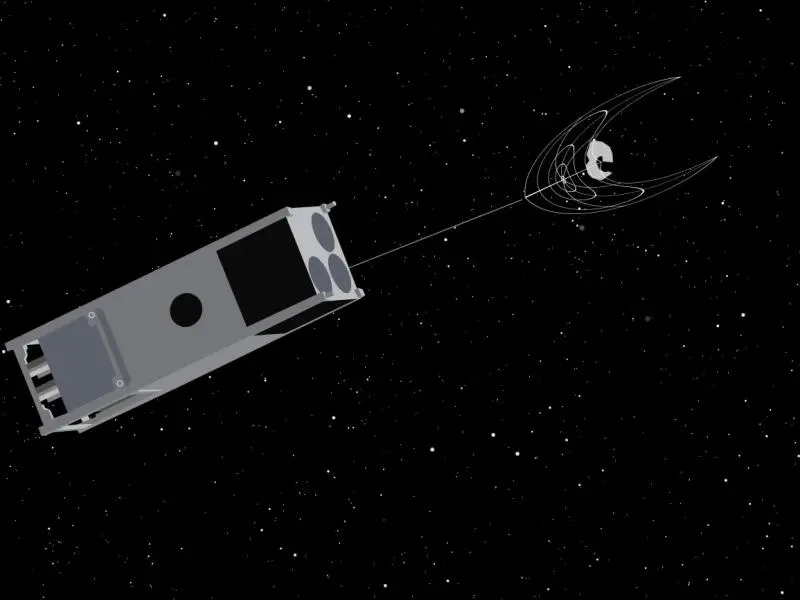 An illustration of OSCaR netting a piece of space junk