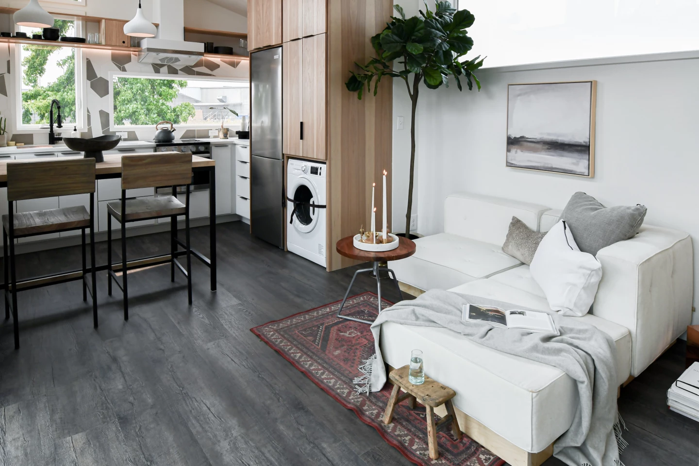 The Urban Park Max's front door opens onto its living room, which includes a large L-shaped sofa
