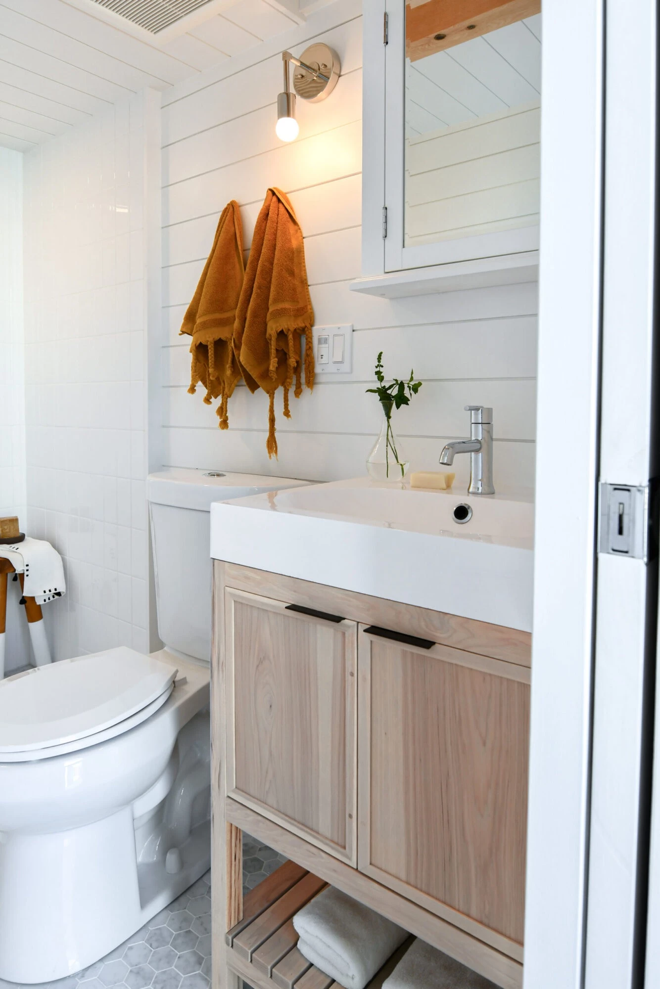 The Urban Park Studio's bathroom includes a vanity sink, shower, and a flushing toilet