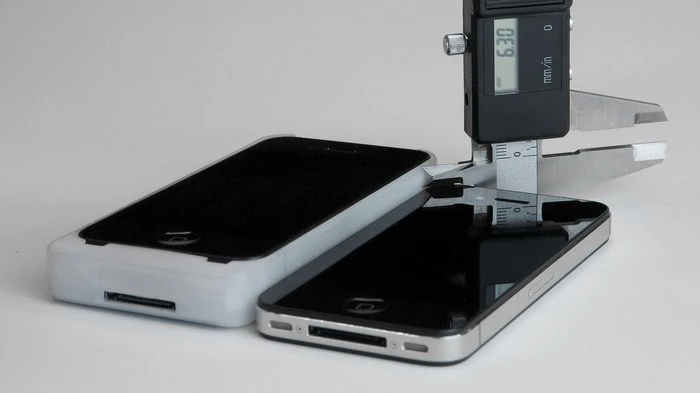 The iExpander side by side with a naked iPhone for thickness comparison