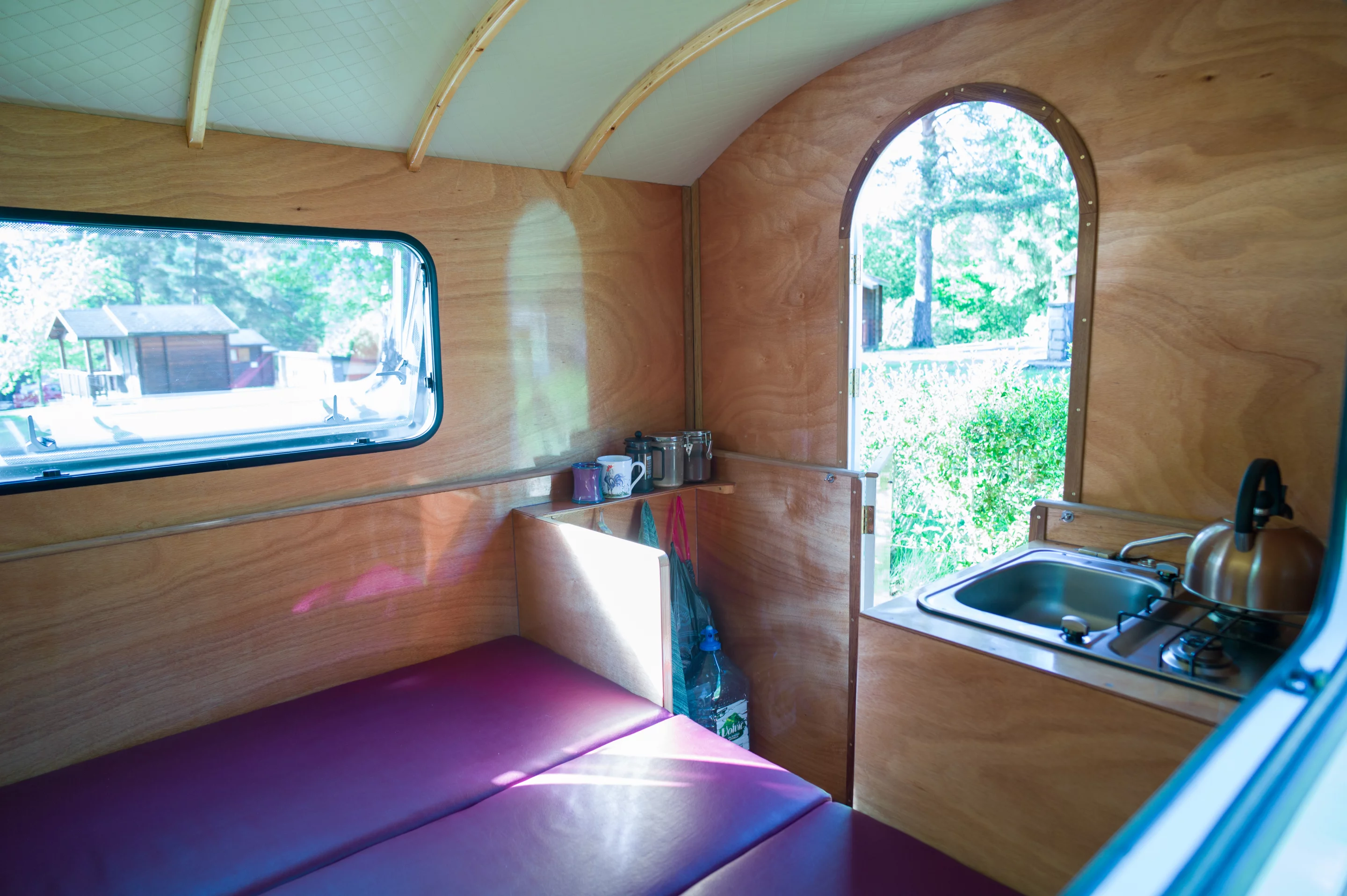 Benjy says the space to the looker's left of the door could be used for a shower or another work area, but he's chosen to dedicate it to open storage