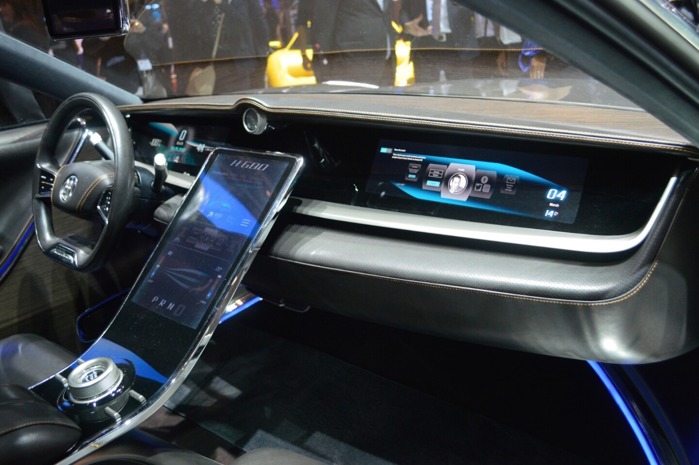 Screens inset into the passenger’s side of the dashboard offer more interface elements for infotainment