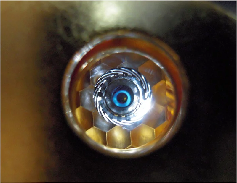 A view of a cryogenically cooled NIF target as "seen" by the laser through the hohlraum's laser entrance hole (Photo: NIF)