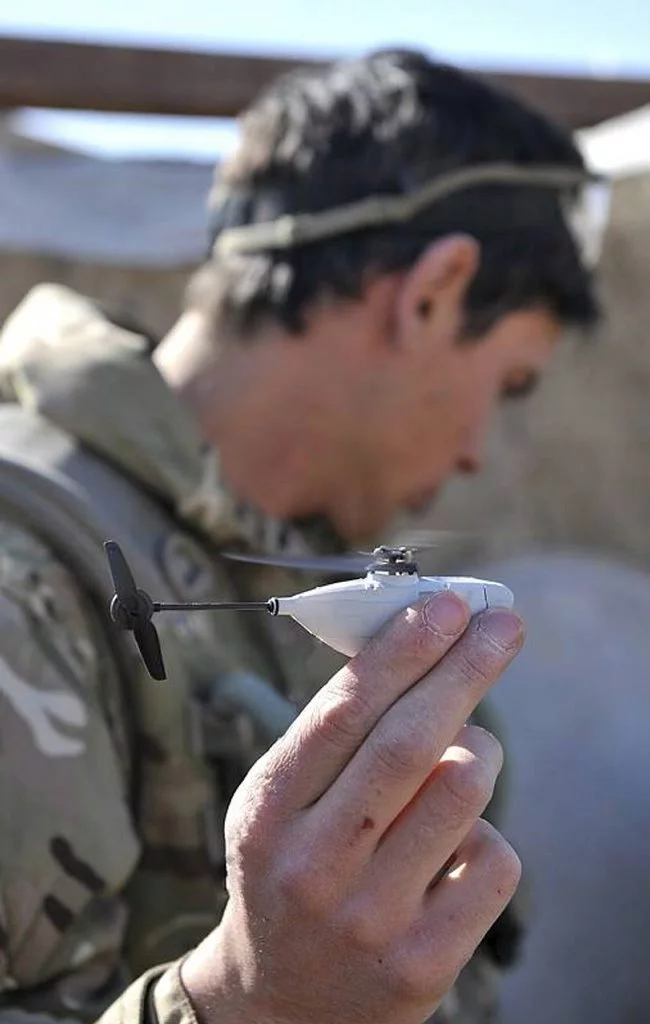 British soldiers in Afghanistan have been issued palm-sized Black Hornet Nano UAVs to scout around corners and obstacles for hidden dangers [Image: © Crown copyright]