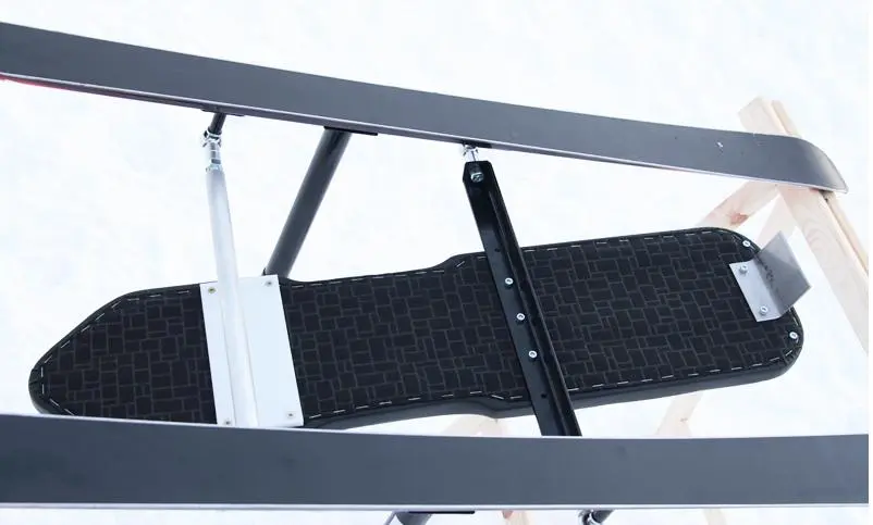 The Snowbull gives the rider control with braking and steering systems (older version)