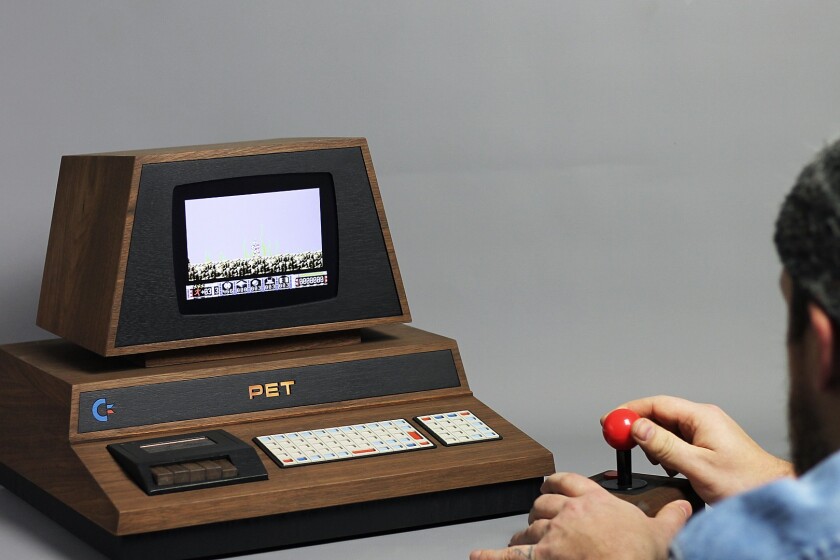 The PET De Lux comes with two wireless games controllers, including one inspired by a TAC-2 joystick