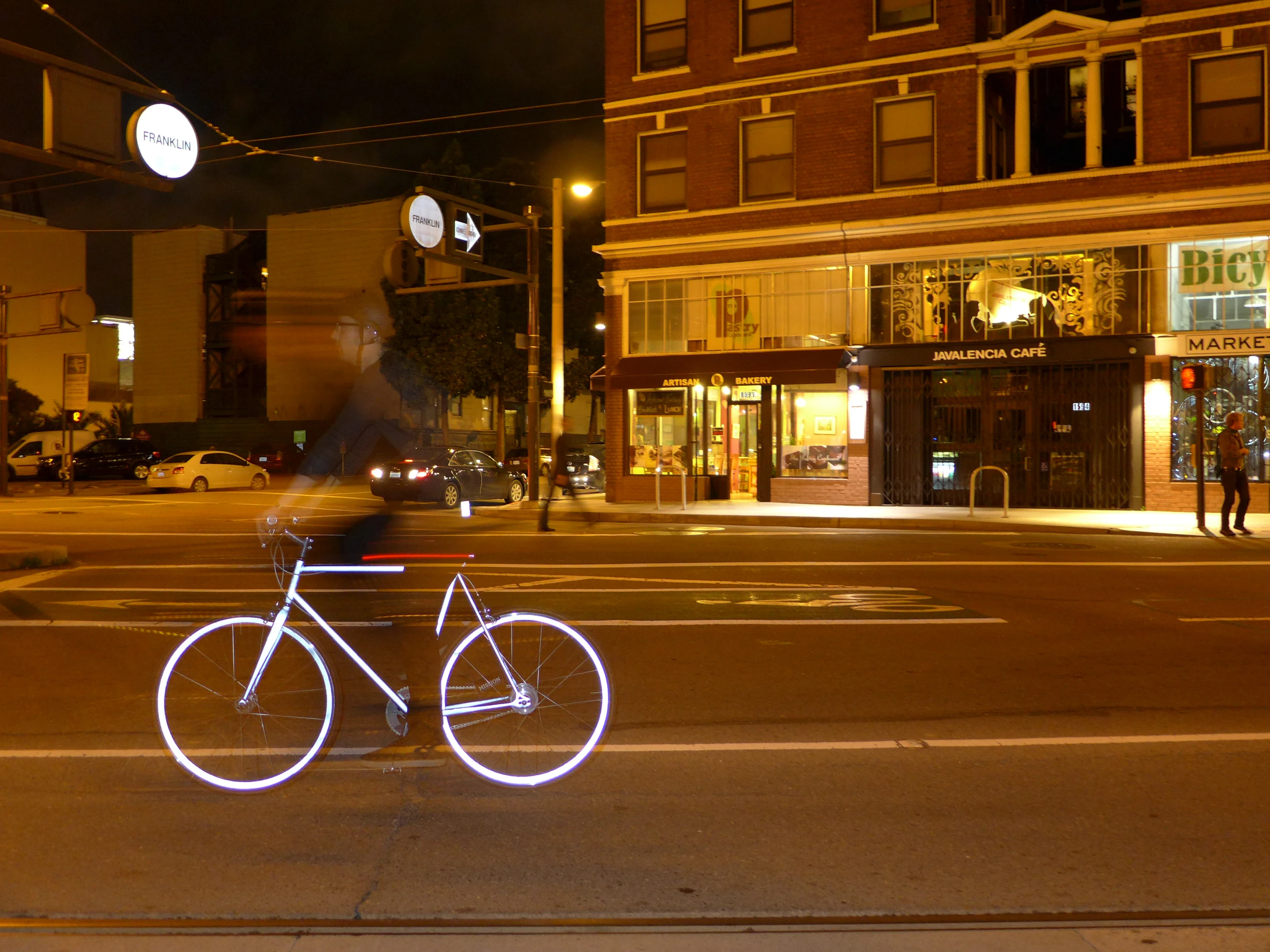 Light hitting the powder-coated frame and wheel rims of the Lumen Retro-Reflective City Bicycle is returned to its source courtesy of tens of thousands of tiny spheres