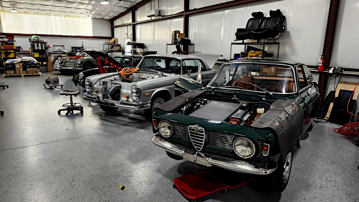 A look inside the Moment Motors shop, featuring classics from Alfa Romeo, Mercedes-Benz, Healy, and Porsche
