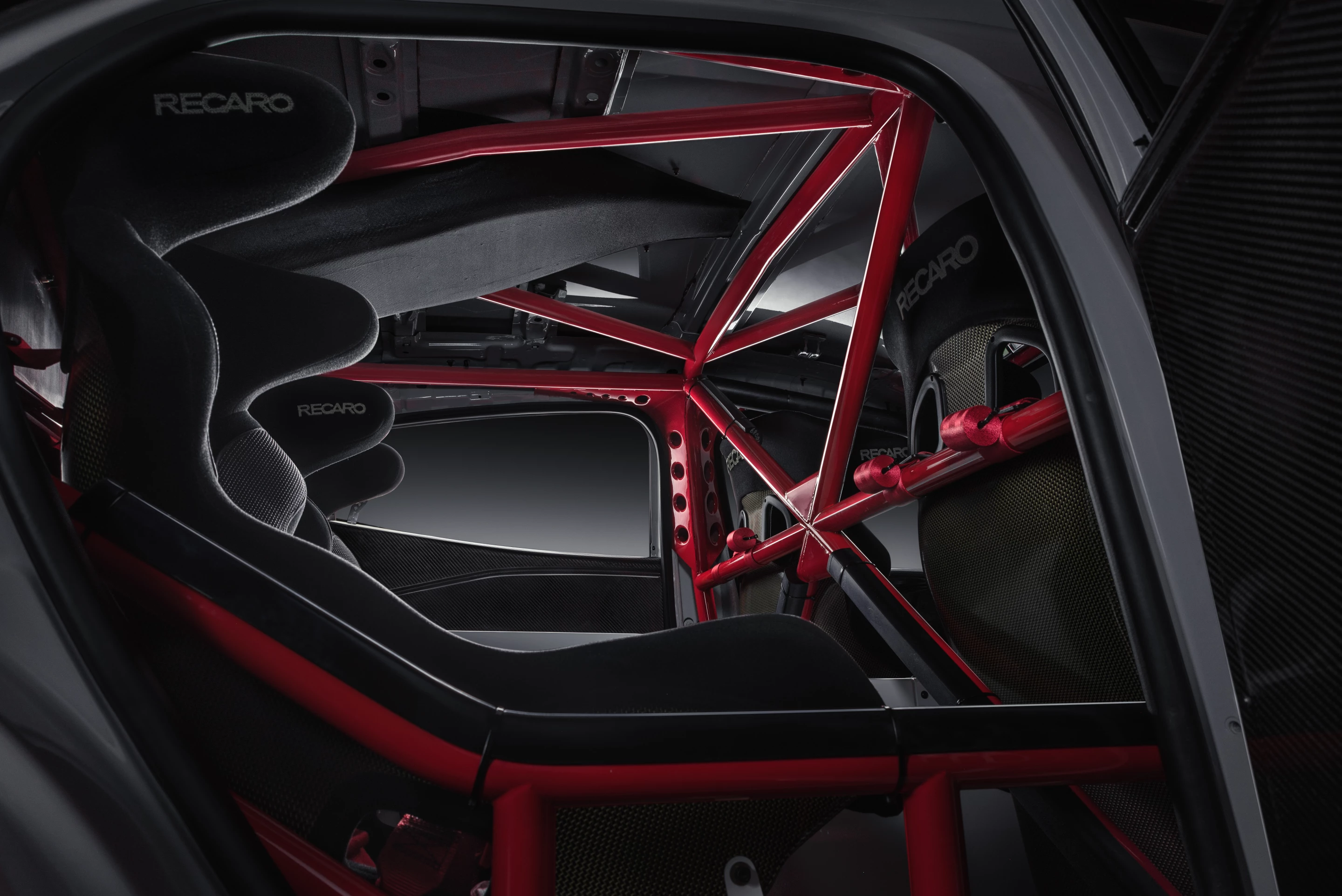 A full roll cage and Recaro seats inside