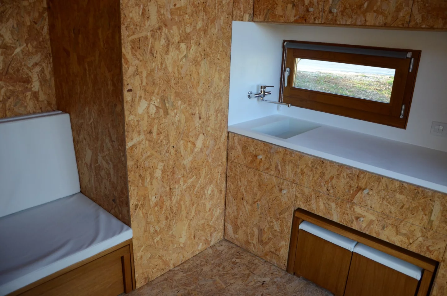 The Ecocubo includes a sofa bed, composting toilet and kitchenette