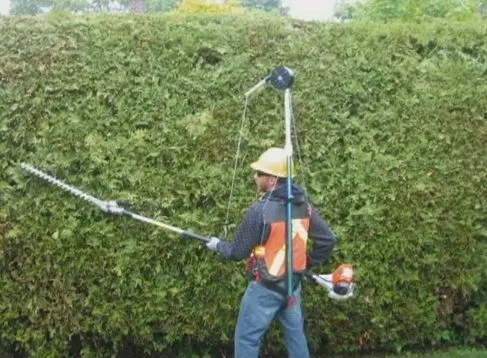 The Portable Support Tool Balancer transfers weight from the user's arms and shoulders to their torso