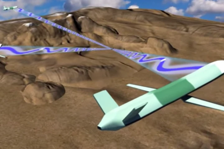 Drones gather target data about a missile radar station while also jamming it, as part of a SoSITE system (Image: DARPA)