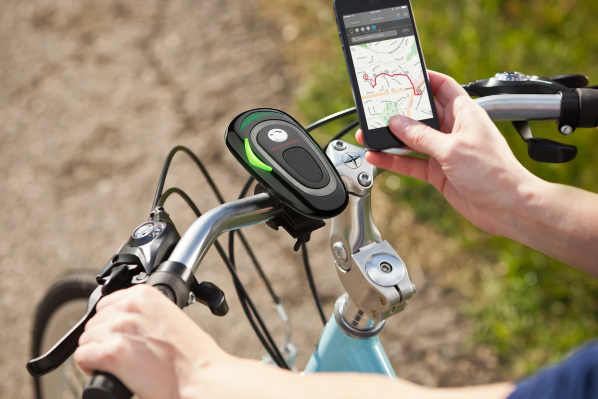 The CycleNav is paired with the user's safely-stowed smartphone