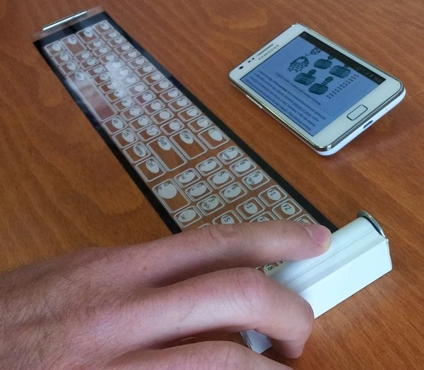 The Qii is a thin, flexible keyboard that connects wirelessly to smart devices and rolls up into a portable case about the size of a roll of coins