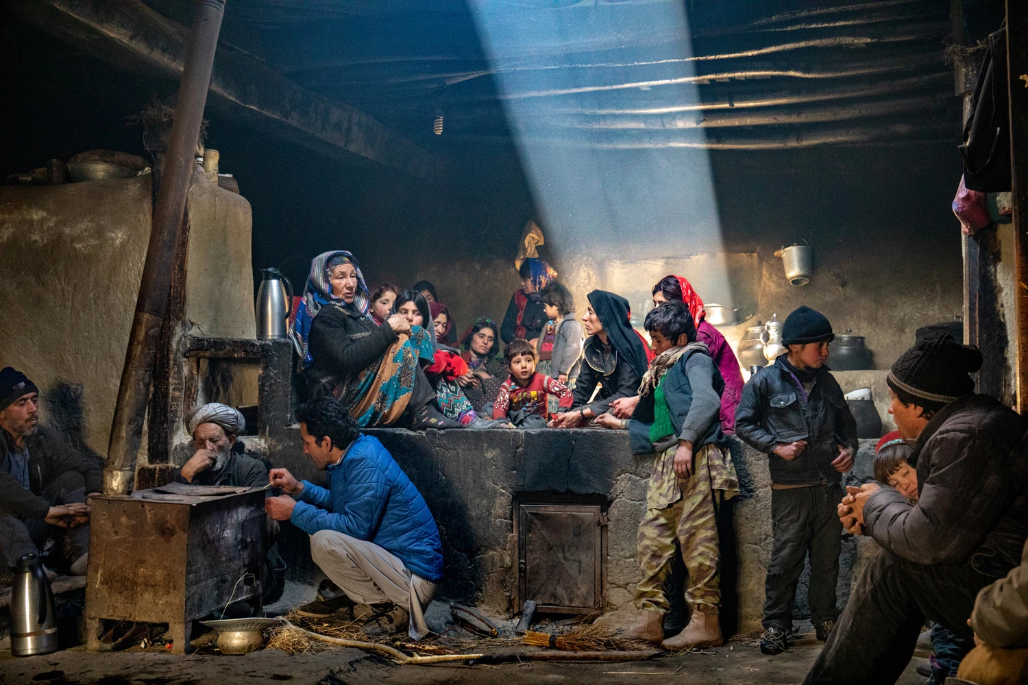 PEOPLE OF THE WORLD PORTFOLIO SINGLE IMAGESSpecial Mention: Jørgen Johanson, NorwayWakhan Corridor, Badakhshan Province, AfghanistanPeople in a traditional family kitchen in a cold day in the Wakhan Corridor.Canon D5 Mark IV, 24-70mm lens, f4, 1/25 sec, ISO 4000