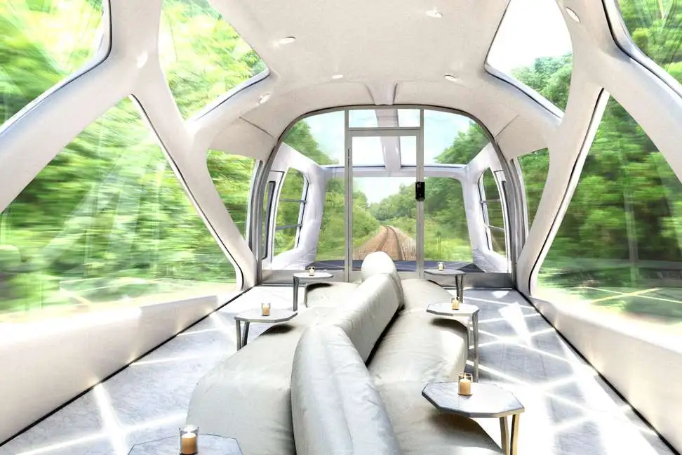 Glass-lined observation cars are located at the front and back of the 10-car train
