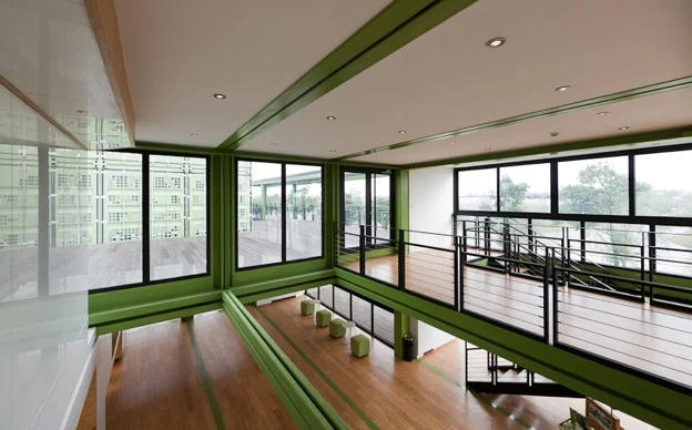 The organic farm's new building is toward the more ambitious end of the scale, incorporating numerous recycled containers, cut up and configured to create remarkably light, open interiors (Photo: Bartosz Kolonko/Playze)