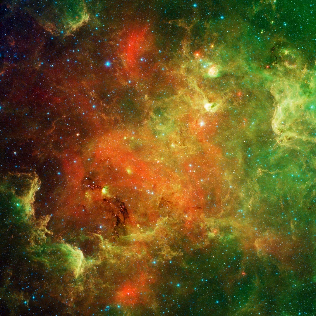 Another infrared view of the North America Nebula, this time with different wavelengths of light assigned different colors, to help highlight its intricate structure.