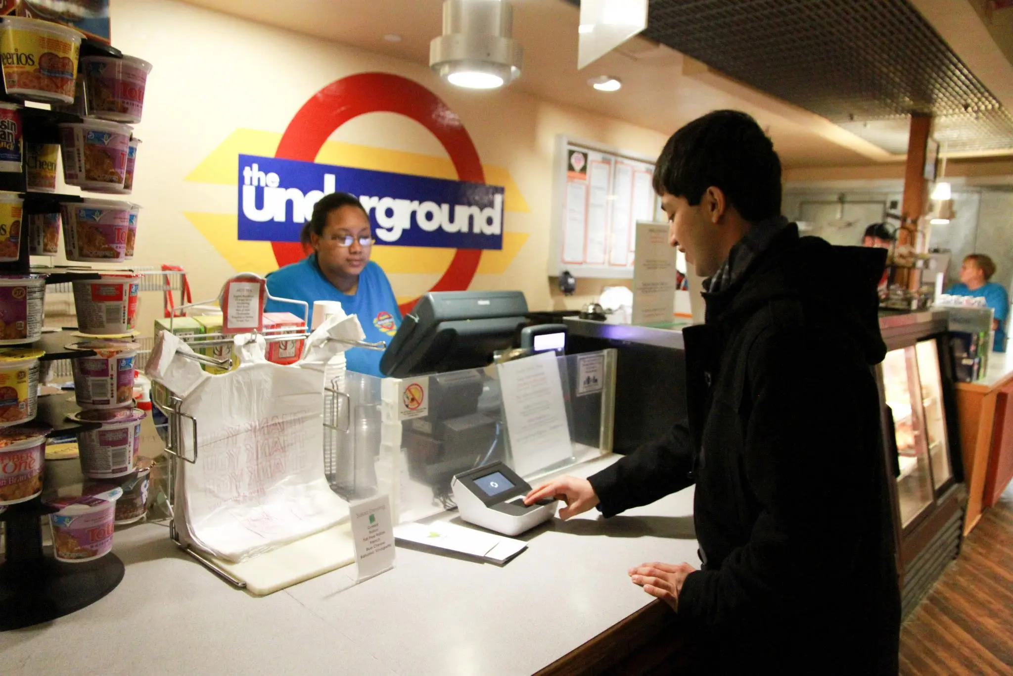 Registered users need only place their fingers on the scanner to pay the bill at the vendor's point-of-sale terminal that's connected to the PayTango reader