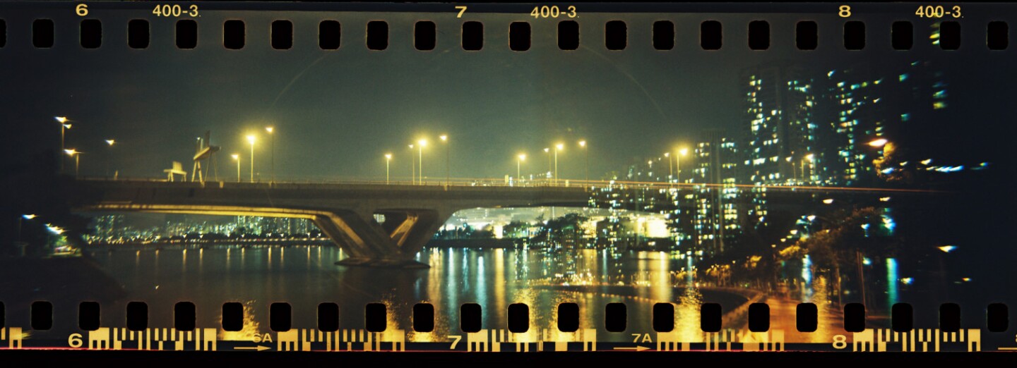 Panoramic film camera features a liquid-filled lens