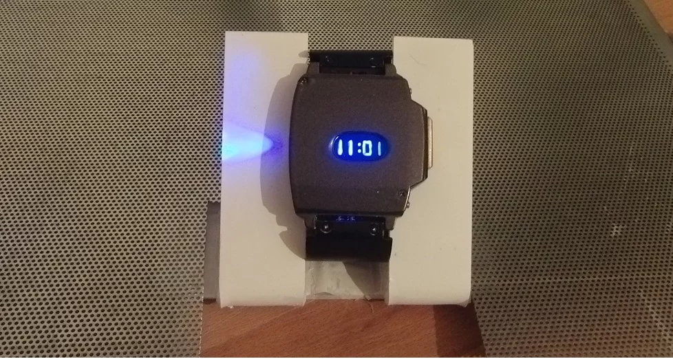 In order to make it look a little more watch-like, Priebe gave the device a fake digital display by scratching numerals into a spray-painted strip of plexiglass. LEDs behind that display create a convincing glow