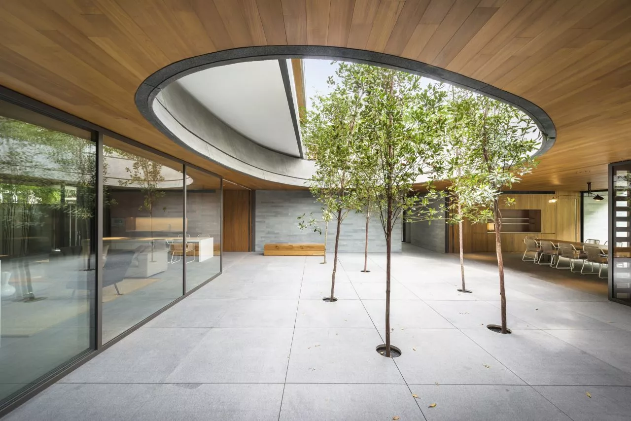 A shared courtyard and pool offer spaces for the family to come together (Photo: Bryan van der Beek and Edward Hendricks)