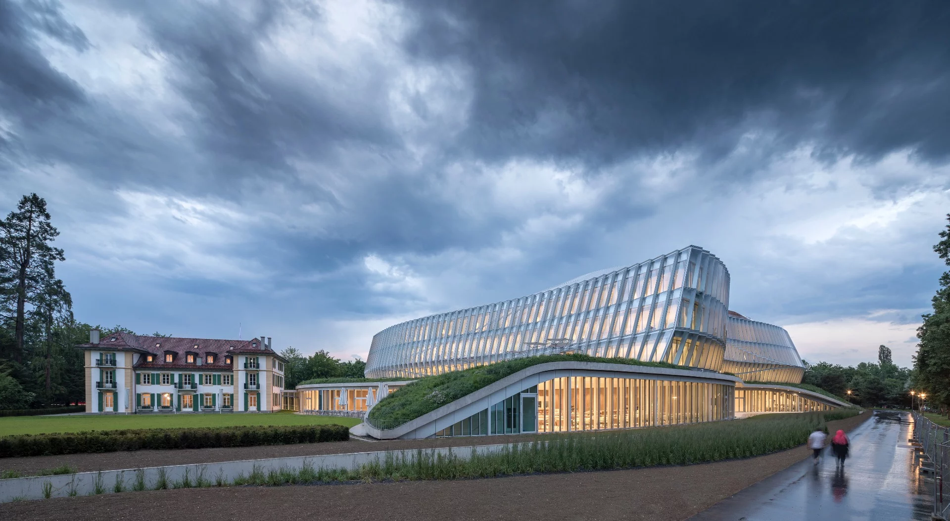 The Olympic House's glazed facade is meant to both reflect the IOC's commitment to transparency and emulate the movements of an athlete