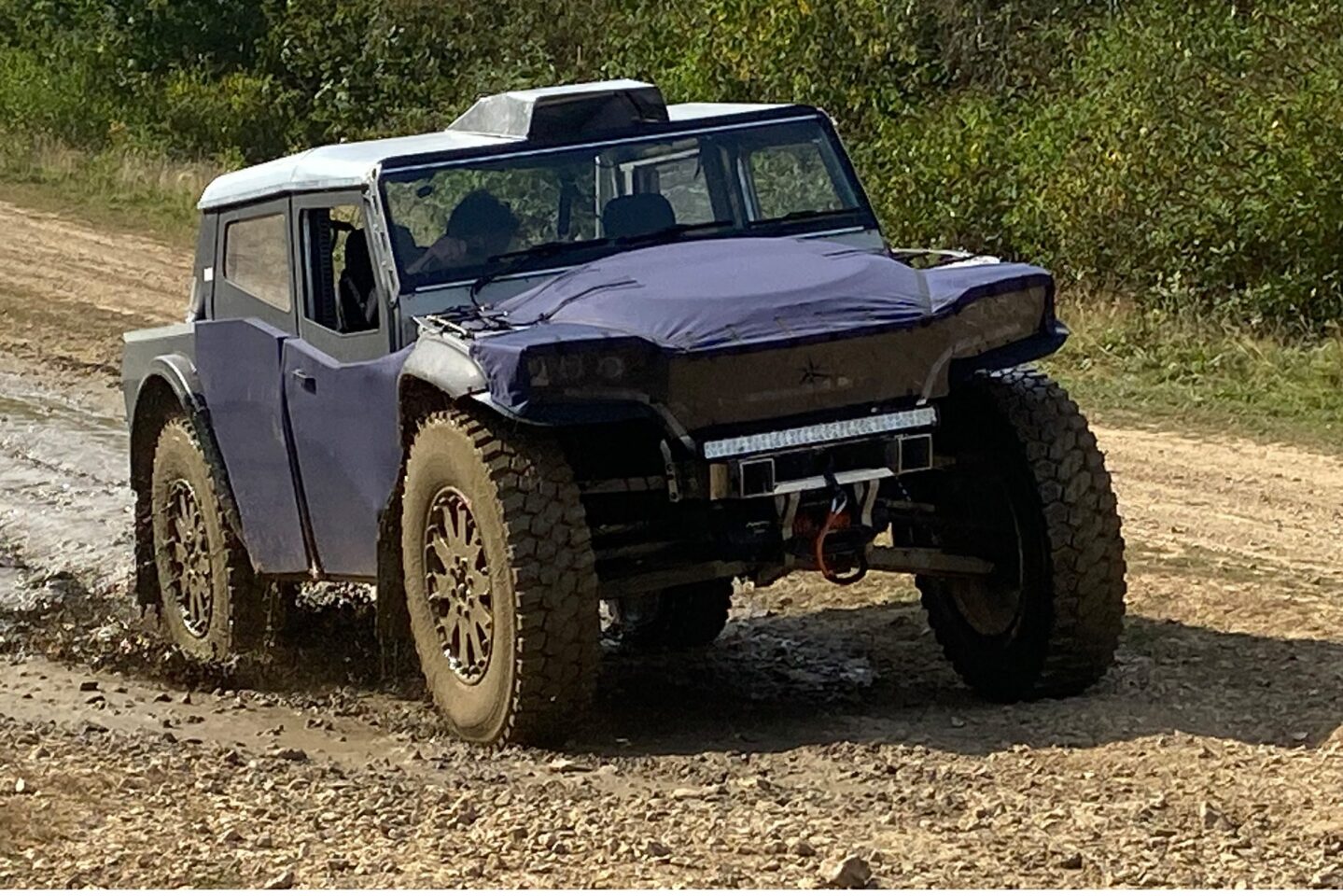 The Pioneer uses an aluminum/composite spaceframe with canvas bodywork, keeping its weight very low
