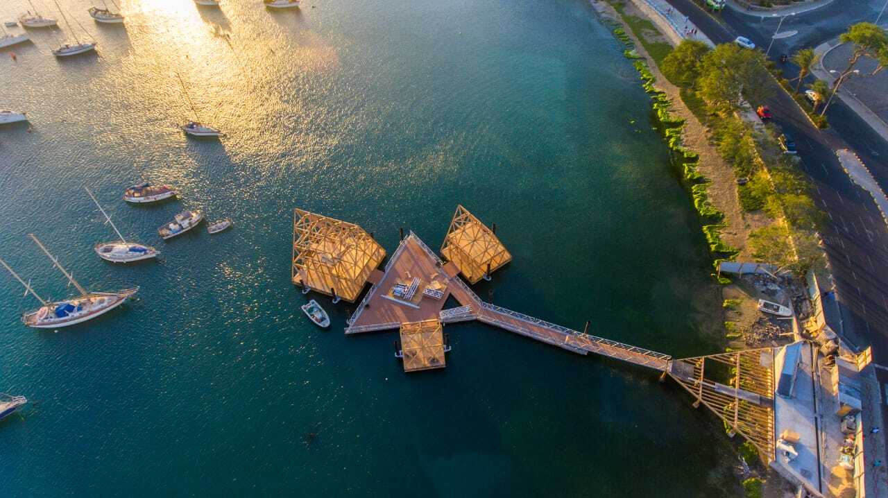 The Floating Music Hub consists of three floating buildings arranged around a triangular plaza