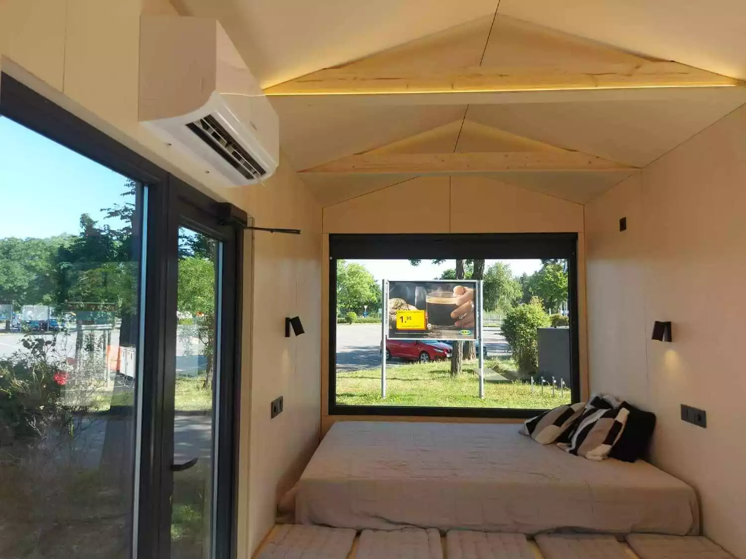 The BTH Single's living/sleeping area includes bench seating and a slightly raised double bed