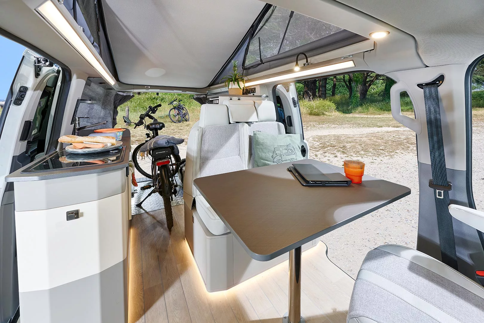 The rear bed splits in half or removes completely to make more storage space; store it on the floor for a camping trip or at home on day trips