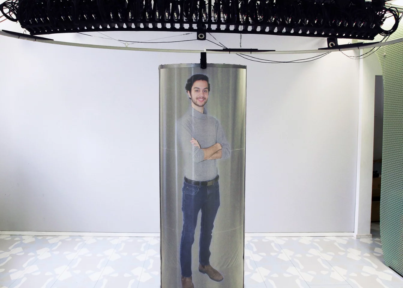 The TeleHuman 2 system uses an array of intelligent projectors to produce a 3D hologram