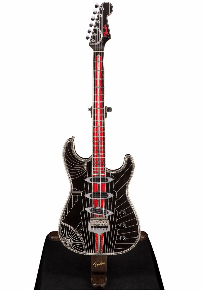 The impressive Studioliner Stratocaster guitar features quite a bit of silver work, some striking Guilloche Enamel inlays and custom made hardware