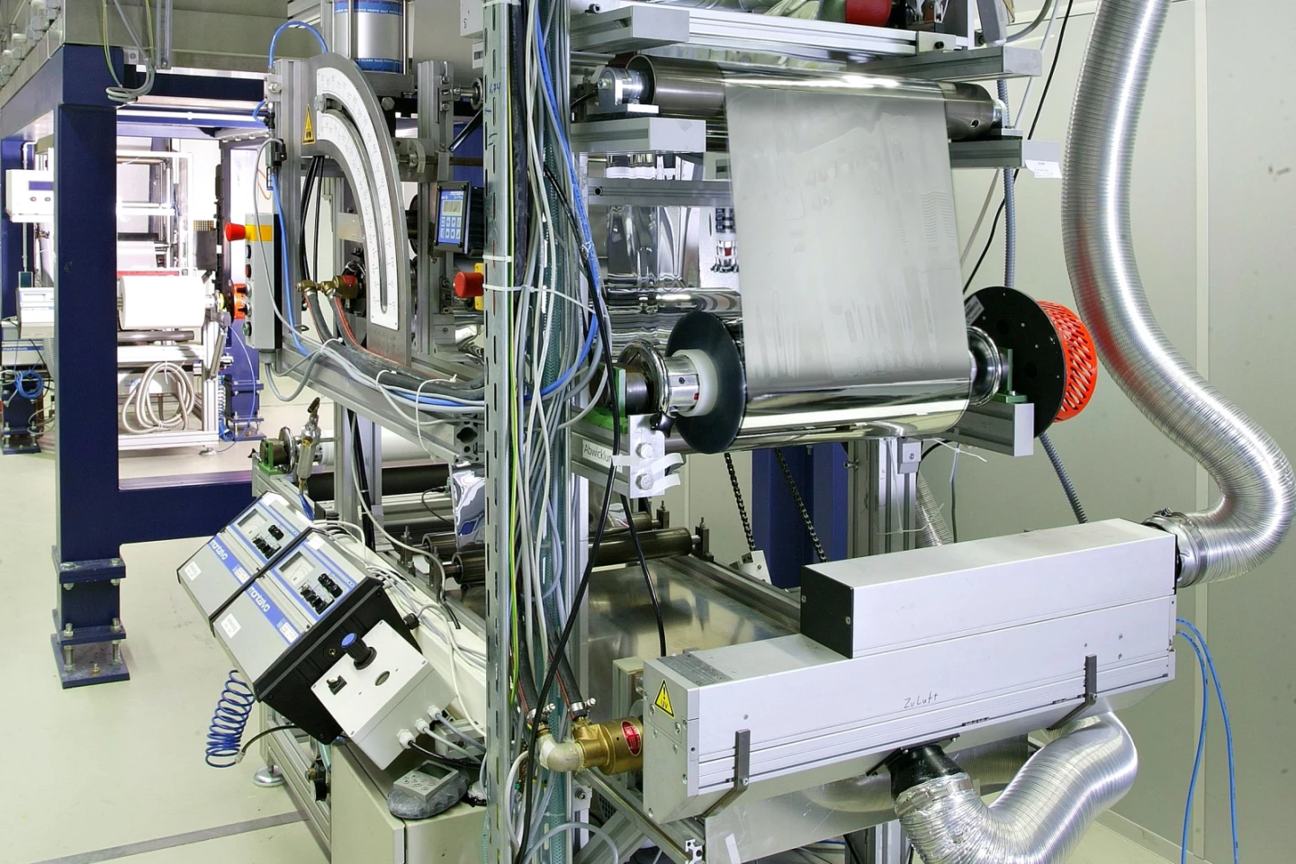 The coating is applied to the paper via a standard roll-to-roll process
