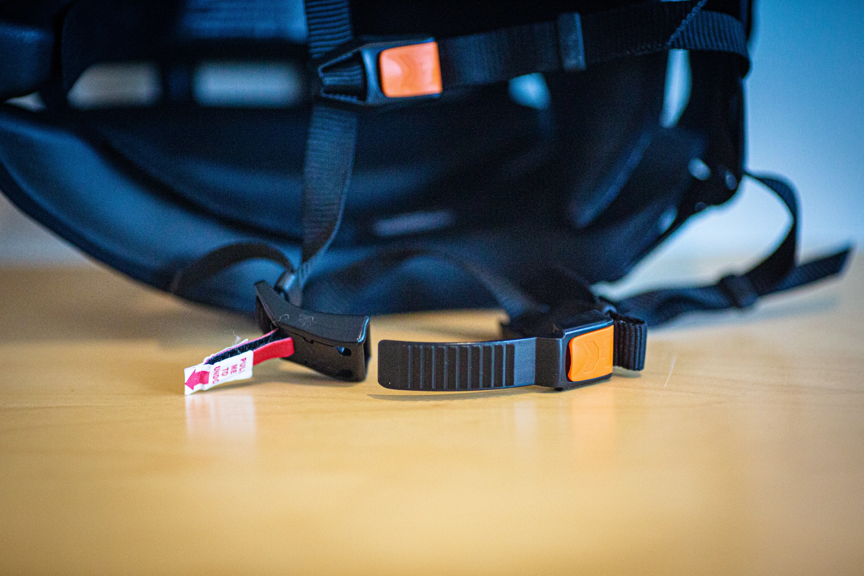 Ratchet strap makes for easy closing and quick release with the pull of that red tab